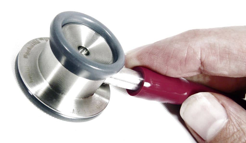 Hand holding a stethoscope