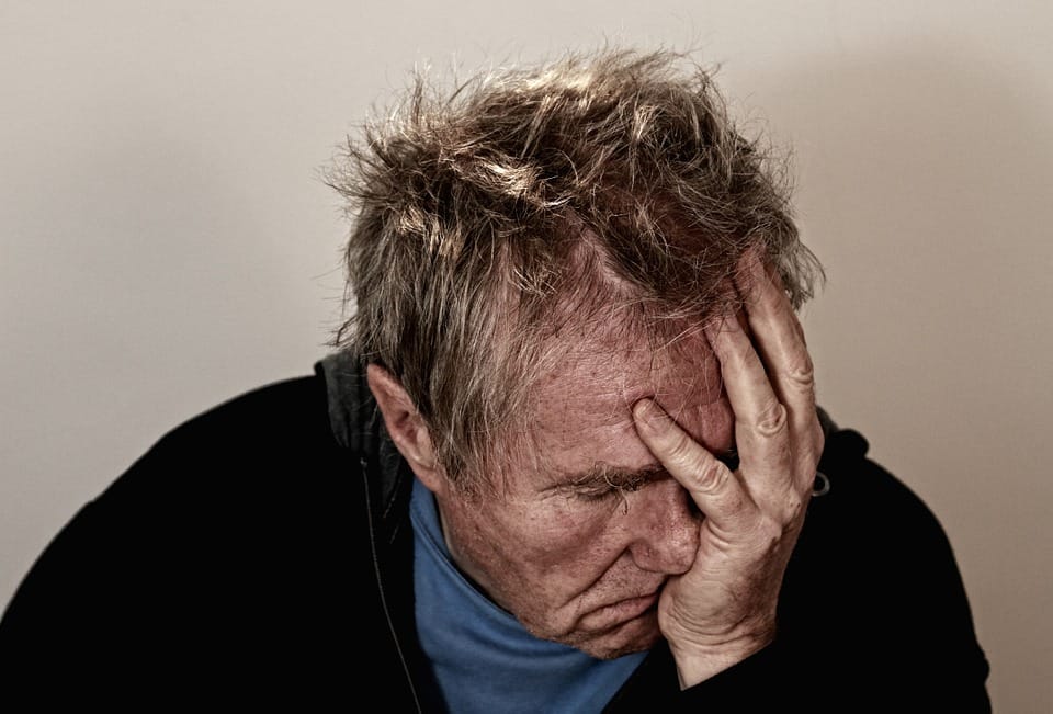 Man holding his head